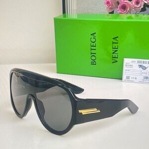 Bottega Veneta Black and Gold Sunglasses with Timeless Design